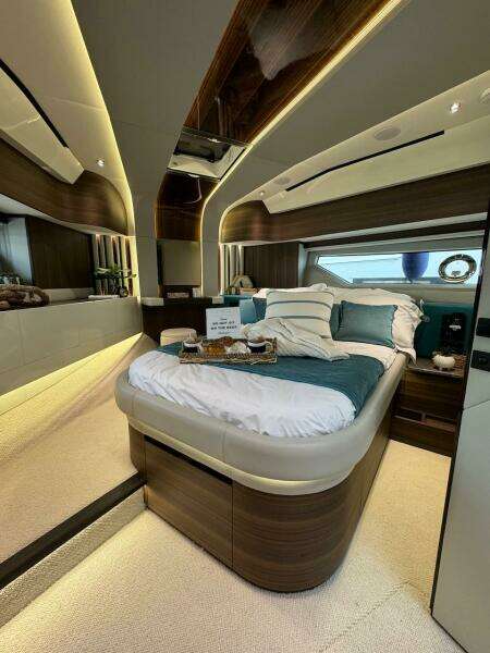Luxurious bedroom interior of 2024 Aicon 66 Vivere yacht with modern design and ambient lighting.