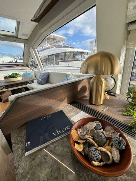 Luxurious interior of 2024 Aicon 66 Vivere yacht with modern decor and scenic view.