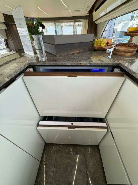 Luxurious interior of 2024 Aicon 66 Vivere yacht with modern kitchen design.