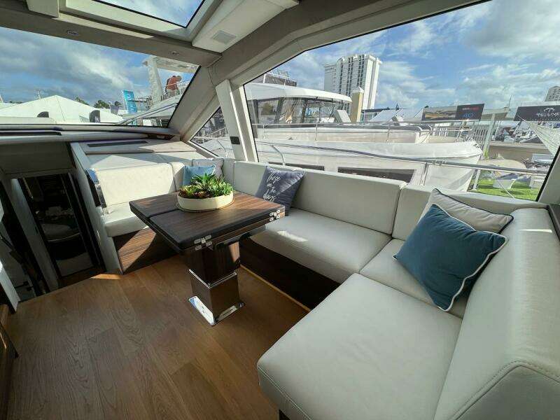 Luxurious interior of 2024 Aicon 66 Vivere yacht with plush seating and modern decor.