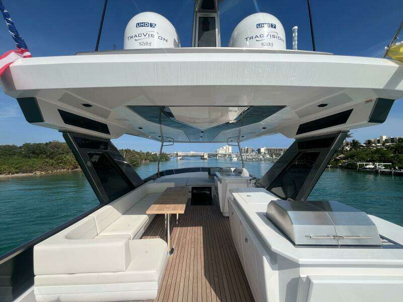 Luxury Aicon 66 Vivere yacht deck, 2024 model, with sleek seating and ocean view.