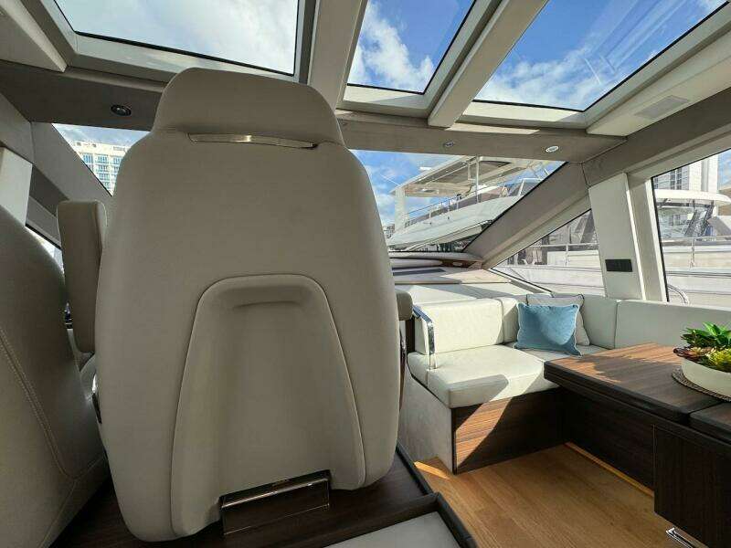 Luxurious interior of 2024 Aicon 66 Vivere yacht with skylights and modern seating.