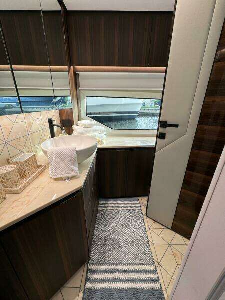 Luxurious bathroom interior of 2024 Aicon 66 Vivere yacht with modern fixtures and elegant design.
