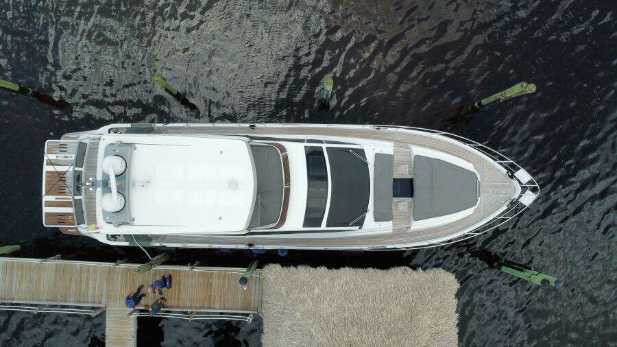 Aerial view of 2024 Aicon 66 Vivere luxury yacht docked at a marina.