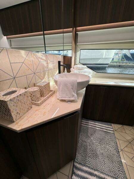 Luxurious bathroom interior of 2024 Aicon 66 Vivere yacht with modern fixtures.
