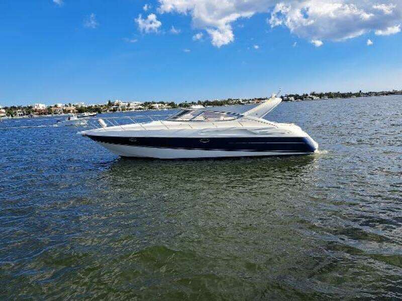2003 Cranchi Endurance 39 yacht on calm water under a blue sky.