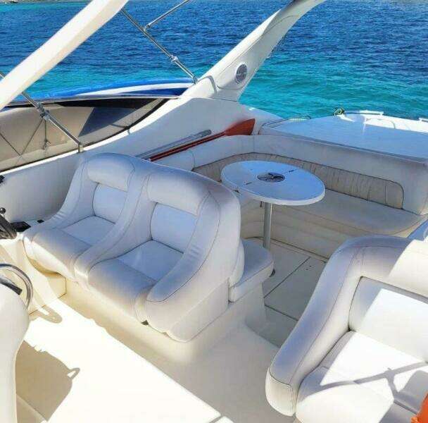 2003 Cranchi Endurance 39 yacht interior with white seating and ocean view.