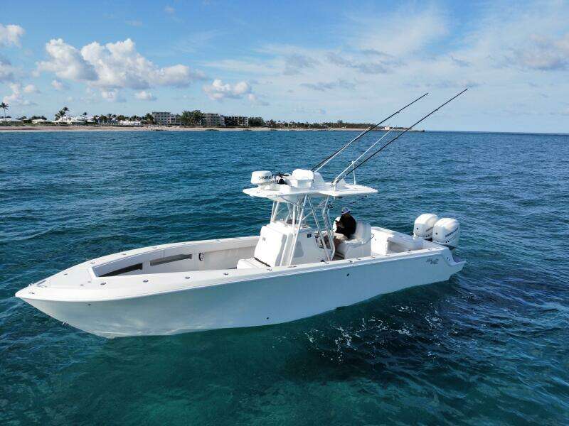 2017 SeaVee 340Z boat on clear blue ocean near coastline.