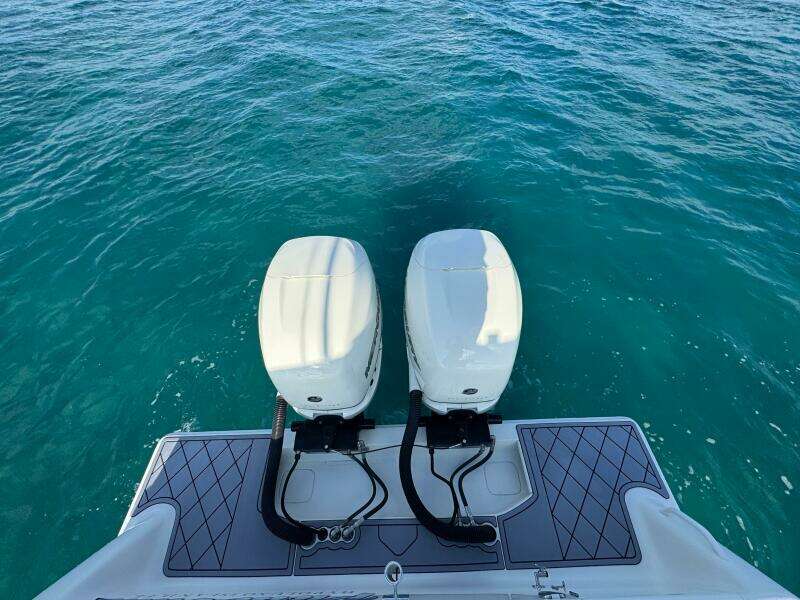 2017 SeaVee 340Z boat with twin outboard engines on clear blue water.