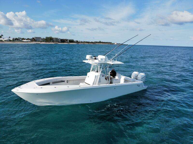 2017 SeaVee 340Z boat on open water, clear sky, fishing rods visible.