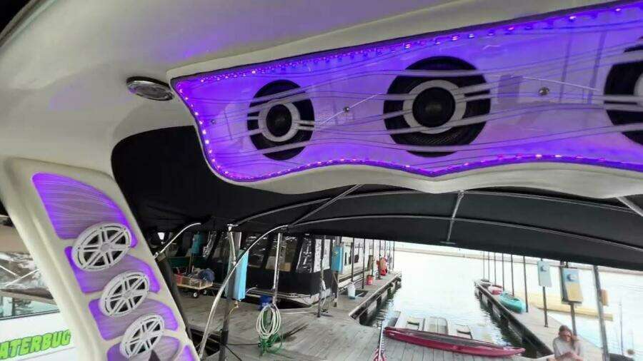2003 Sea Ray 380 Sundancer with illuminated speakers and dock view.