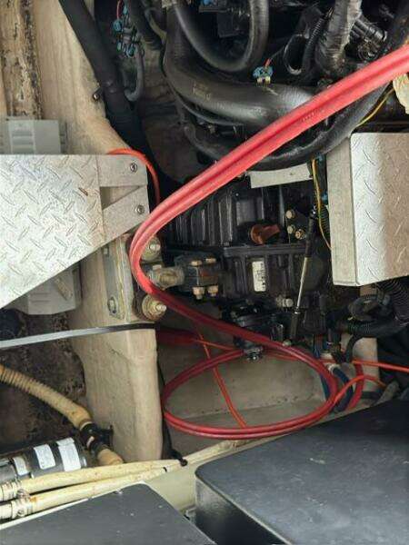 Engine compartment of a 2003 Sea Ray 380 Sundancer with visible wiring and components.