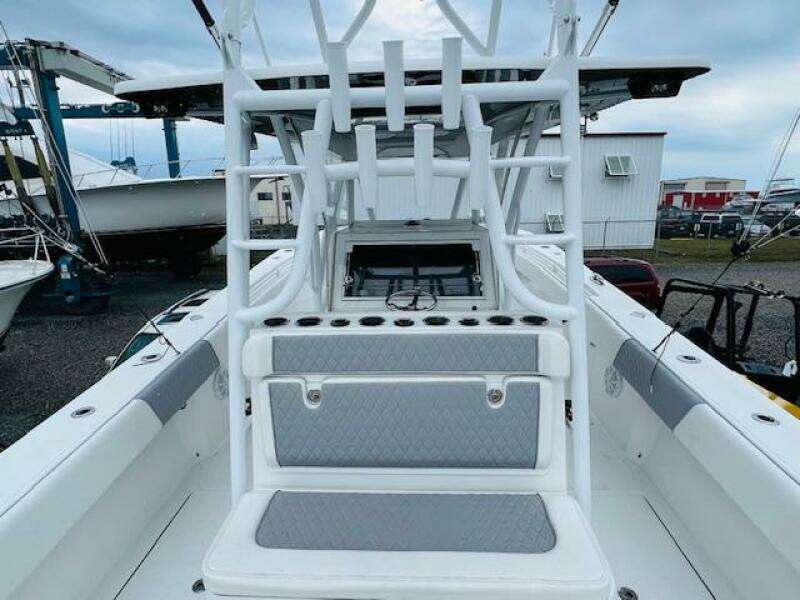 2020 SeaHunter 39 Tournament boat interior with rod holders and seating, docked at a marina.