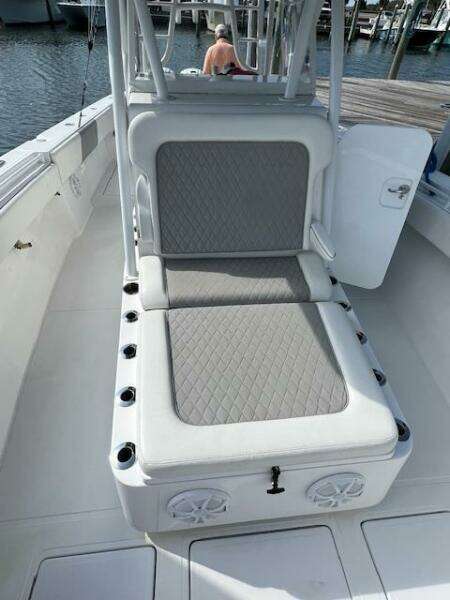 2020 SeaHunter 39 Tournament boat with cushioned seating and rod holders, docked at marina.