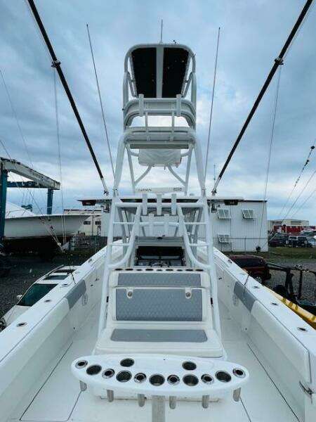 2020 SeaHunter 39 Tournament boat with tower and rod holders, docked under cloudy skies.