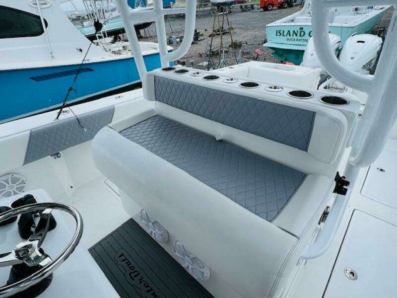 SeaHunter 39 Tournament 2020 boat interior with cushioned seating and rod holders.