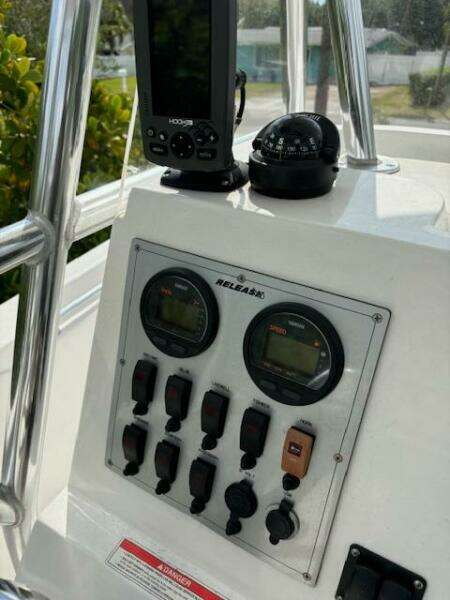 Control panel of a 2016 Release 208 RX boat with gauges and navigation equipment.