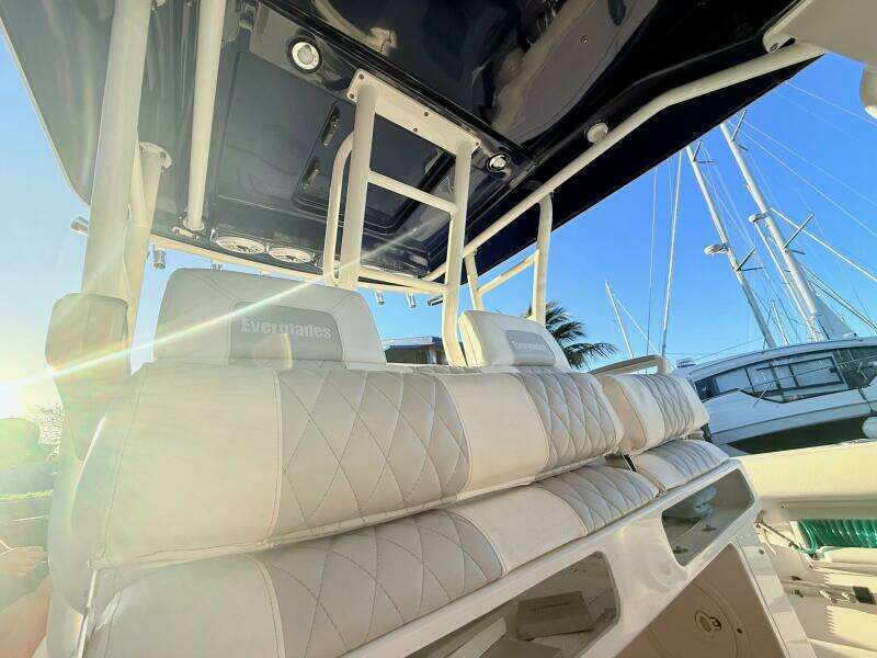 2014 Everglades 355 Center Console boat interior with white seating and overhead view.