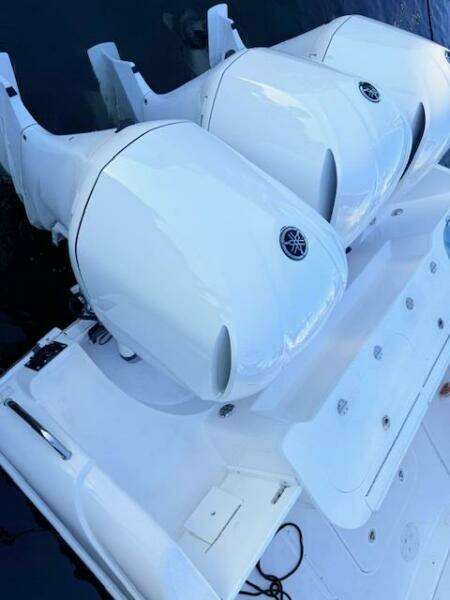 2014 Everglades 355 Center Console with twin outboard engines, viewed from above.
