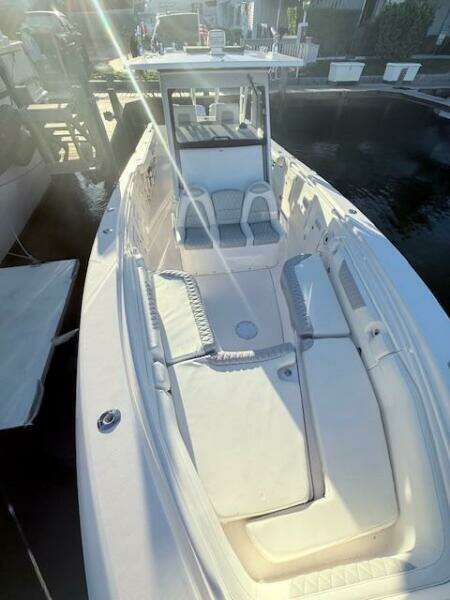 2014 Everglades 355 Center Console boat with spacious seating and sleek design.