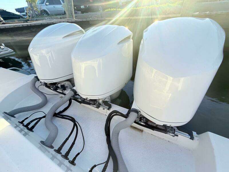 Triple outboard engines on a 2014 Everglades 355 Center Console boat.