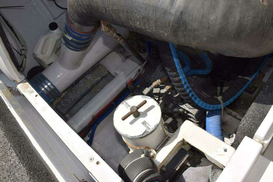 Port Side Motor Aft, Racor Filter, Fiberglass Surge Tubes