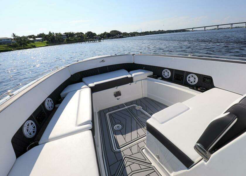 2023 Monterey 385 Super Sport boat interior with luxurious seating and scenic water view.