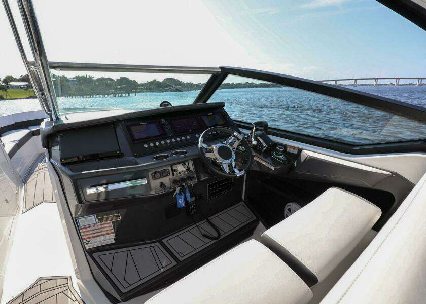 2023 Monterey 385 Super Sport boat interior with modern dashboard and steering wheel.
