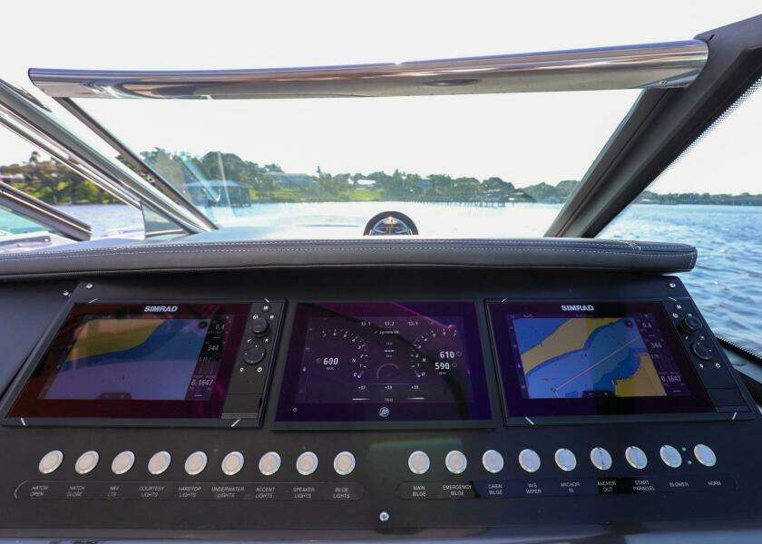 Dashboard of 2023 Monterey 385 Super Sport boat with navigation screens.
