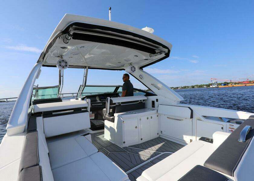 2023 Monterey 385 Super Sport boat interior with seating, helm, and open water view.