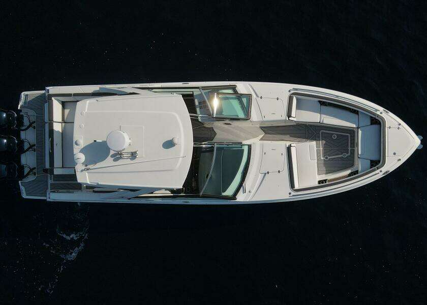 Aerial view of 2023 Monterey 385 Super Sport boat on dark water.