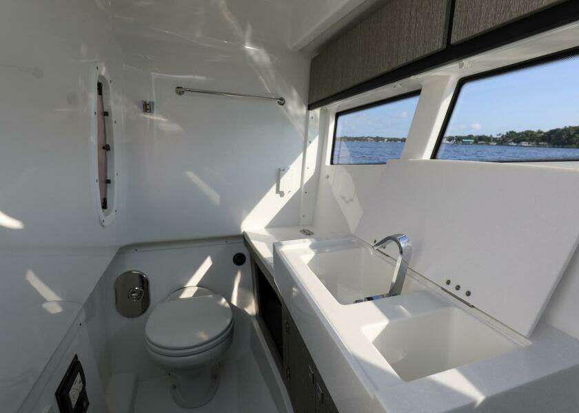 Bathroom interior of 2023 Monterey 385 Super Sport yacht with ocean view.