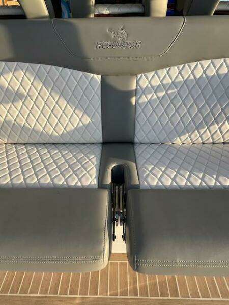 2024 Regulator 41 boat seat with diamond-stitched upholstery and integrated cup holder.