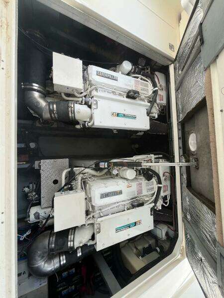 Engine compartment of a 2001 Sea Ray 410 Sundancer boat, showcasing dual engines.