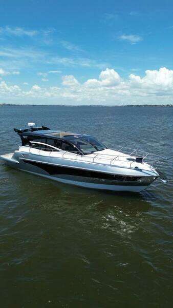 2025 Real 40 HT Luxury yacht cruising on a sunny day.