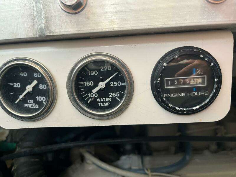 Gauges on a 2000 Carver 396 Motor Yacht showing oil pressure, water temperature, and engine hours.