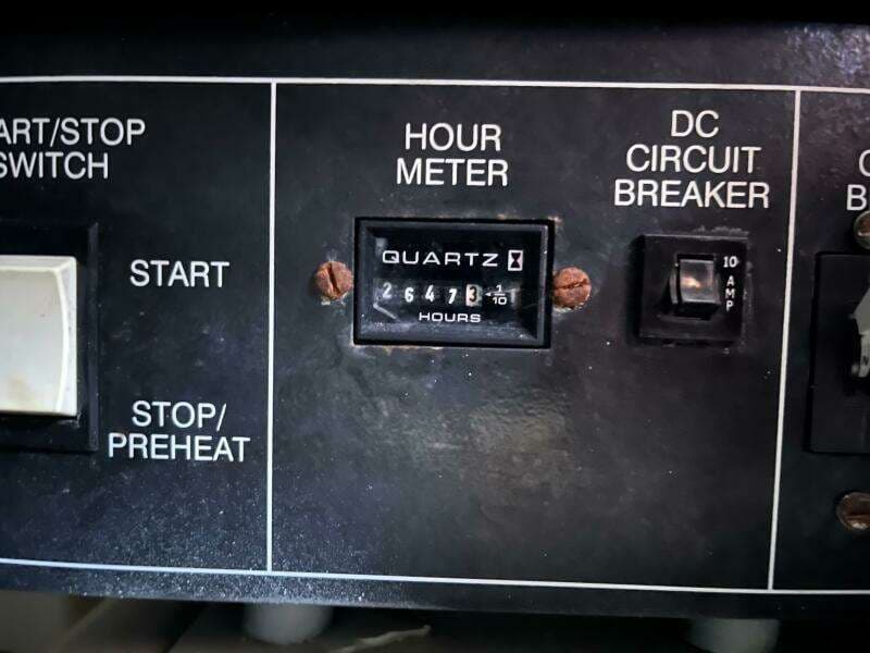 Control panel of 2000 Carver 396 Motor Yacht with hour meter and circuit breaker.