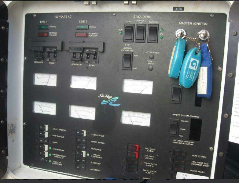 Control panel of a 1993 Sea Ray 440 Sundancer boat with ignition keys.