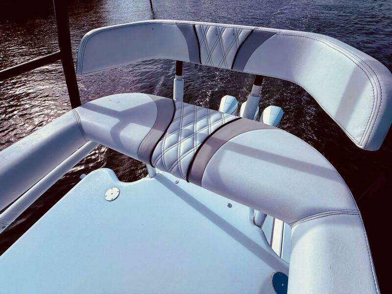 2024 Contender 39 ST boat seat with quilted design, overlooking water.