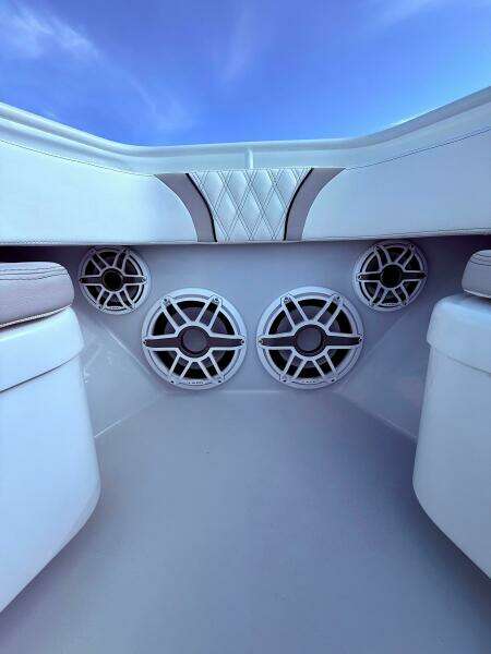 2024 Contender 39 ST boat interior with premium speakers and cushioned seating.