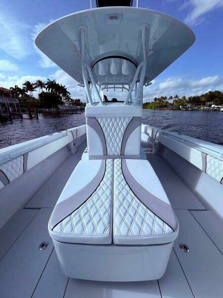2024 Contender 39 ST boat interior with luxurious seating and sleek design on a sunny day.