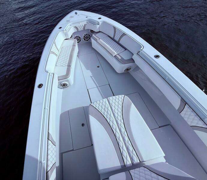 2024 Contender 39 ST boat interior with luxurious seating and sleek design on the water.