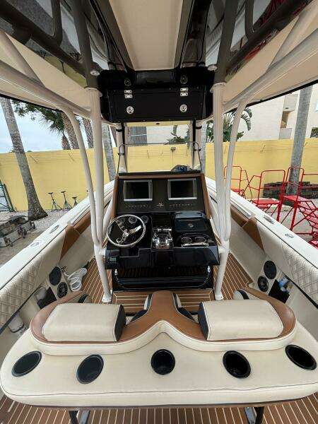 2013 Statement 35 Center Console boat interior with dual screens and steering wheel.