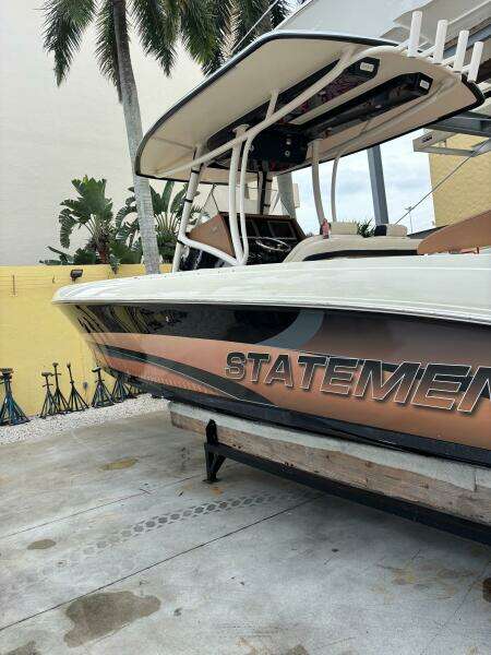 2013 Statement 35 Center Console boat on display, featuring sleek design and bold graphics.