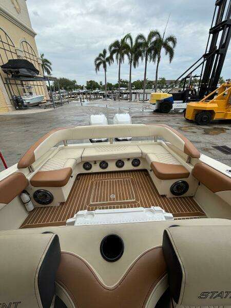 Luxurious 2013 Statement 35 Center Console boat interior with plush seating and teak flooring.