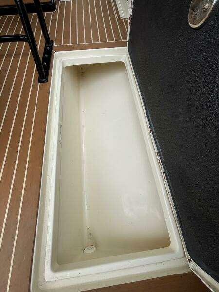 Open storage compartment on 2013 Statement 35 Center Console boat deck.