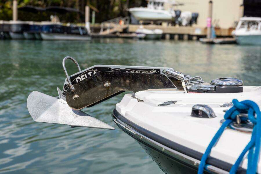 2023 Monterey 255 Super Sport boat with anchor, docked in marina.
