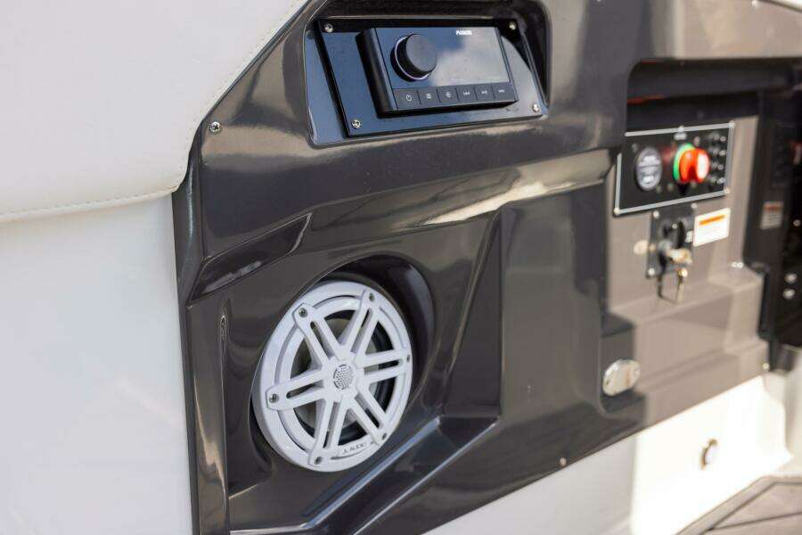 2023 Monterey 255 Super Sport boat dashboard with speaker and control panel.
