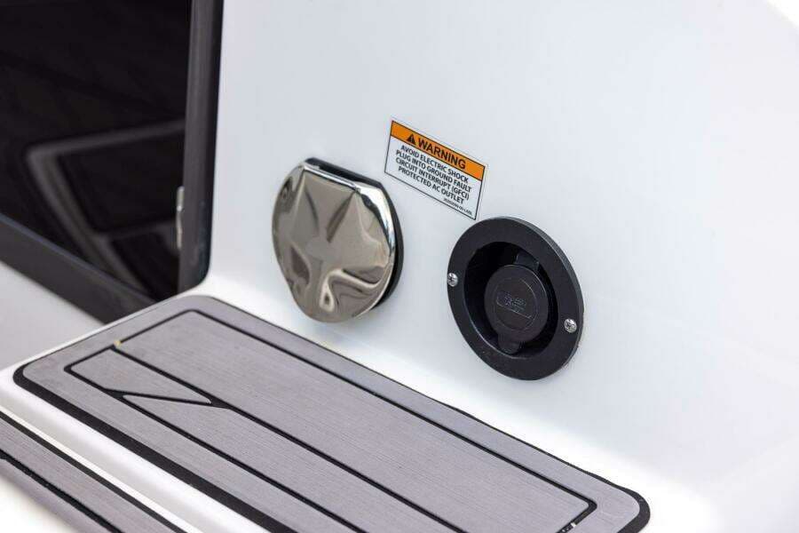 2023 Monterey 255 Super Sport boat detail with warning label and fittings.