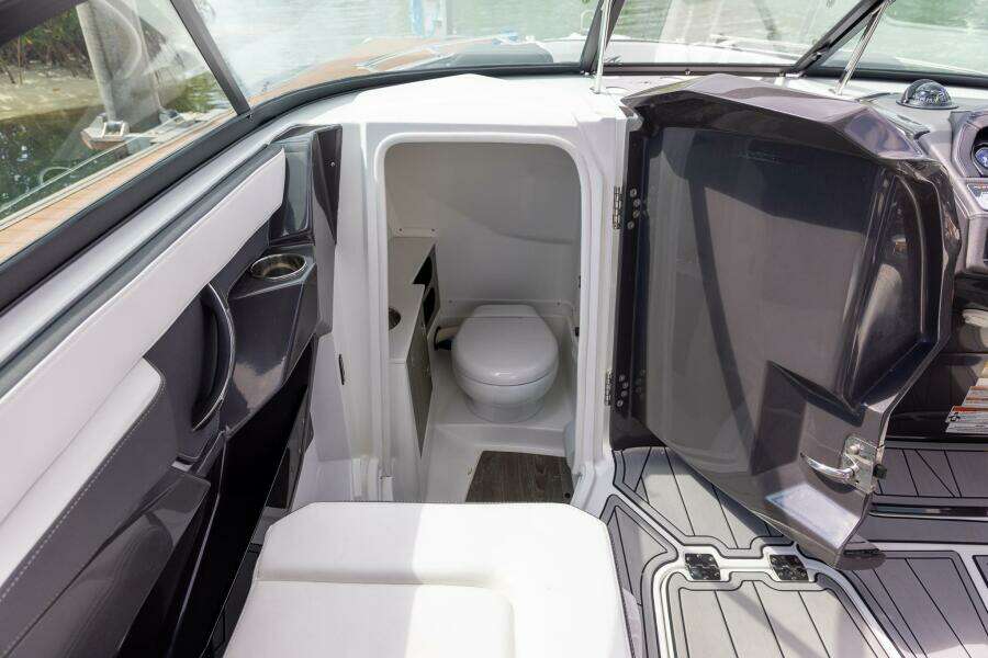 2023 Monterey 255 Super Sport boat interior with compact bathroom.